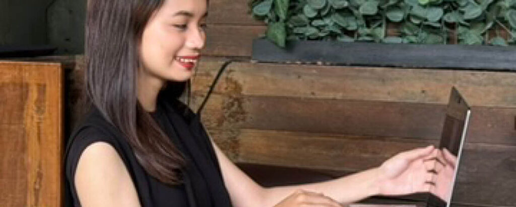 girl on laptop smiling